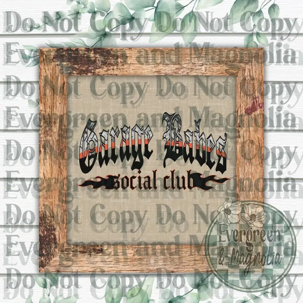 a wooden frame with the text "Garage Boys Social club" written on it, set against a background of green leaves and a white wooden wall.