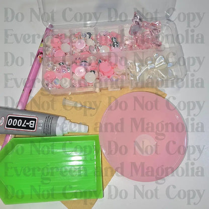 Rhinestone kit with wax pencil, glue-acrylic lid, tray, sandpaper, and charms